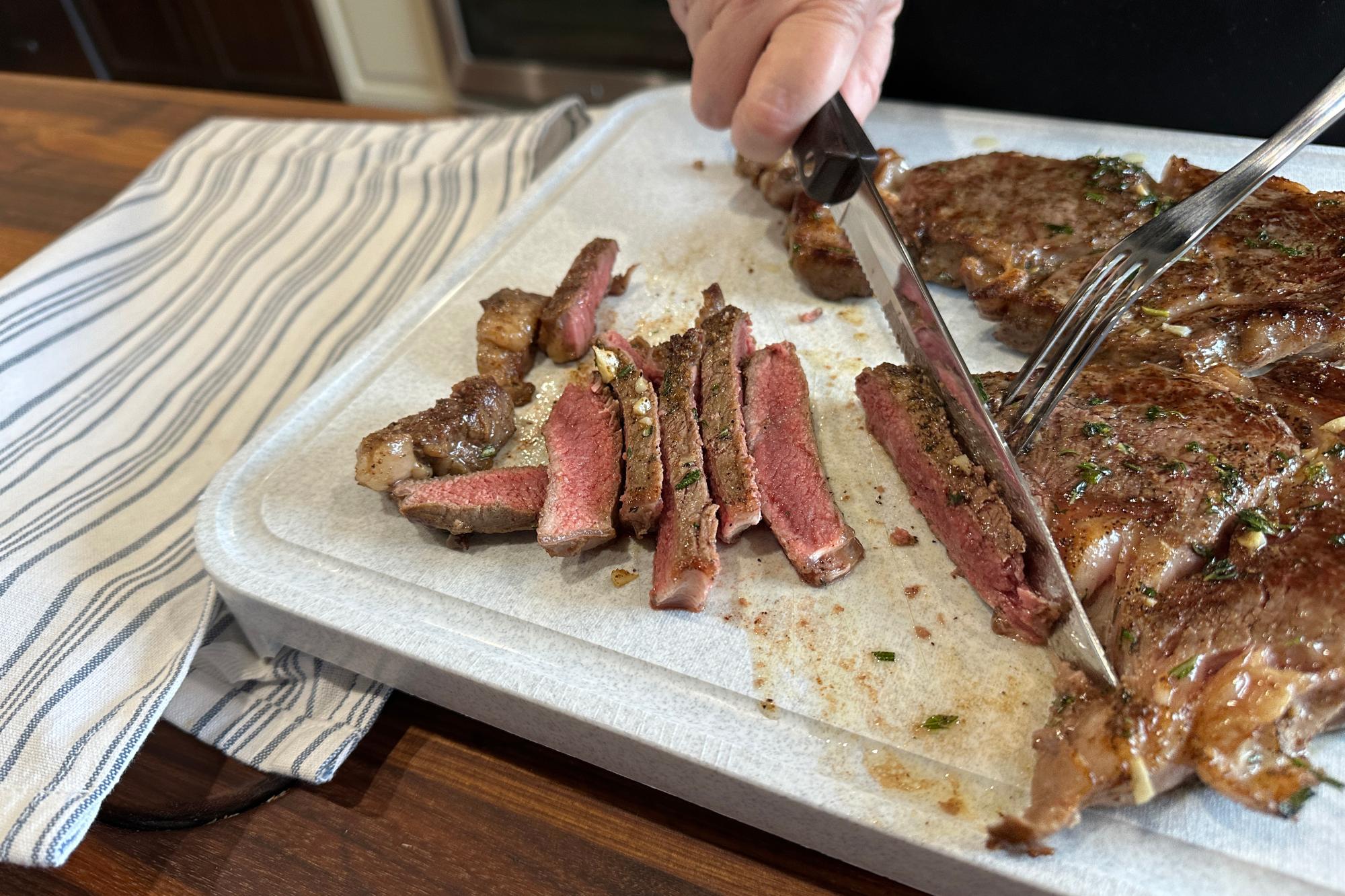 Slice the steak with a Petite Carver and Turning Fork.