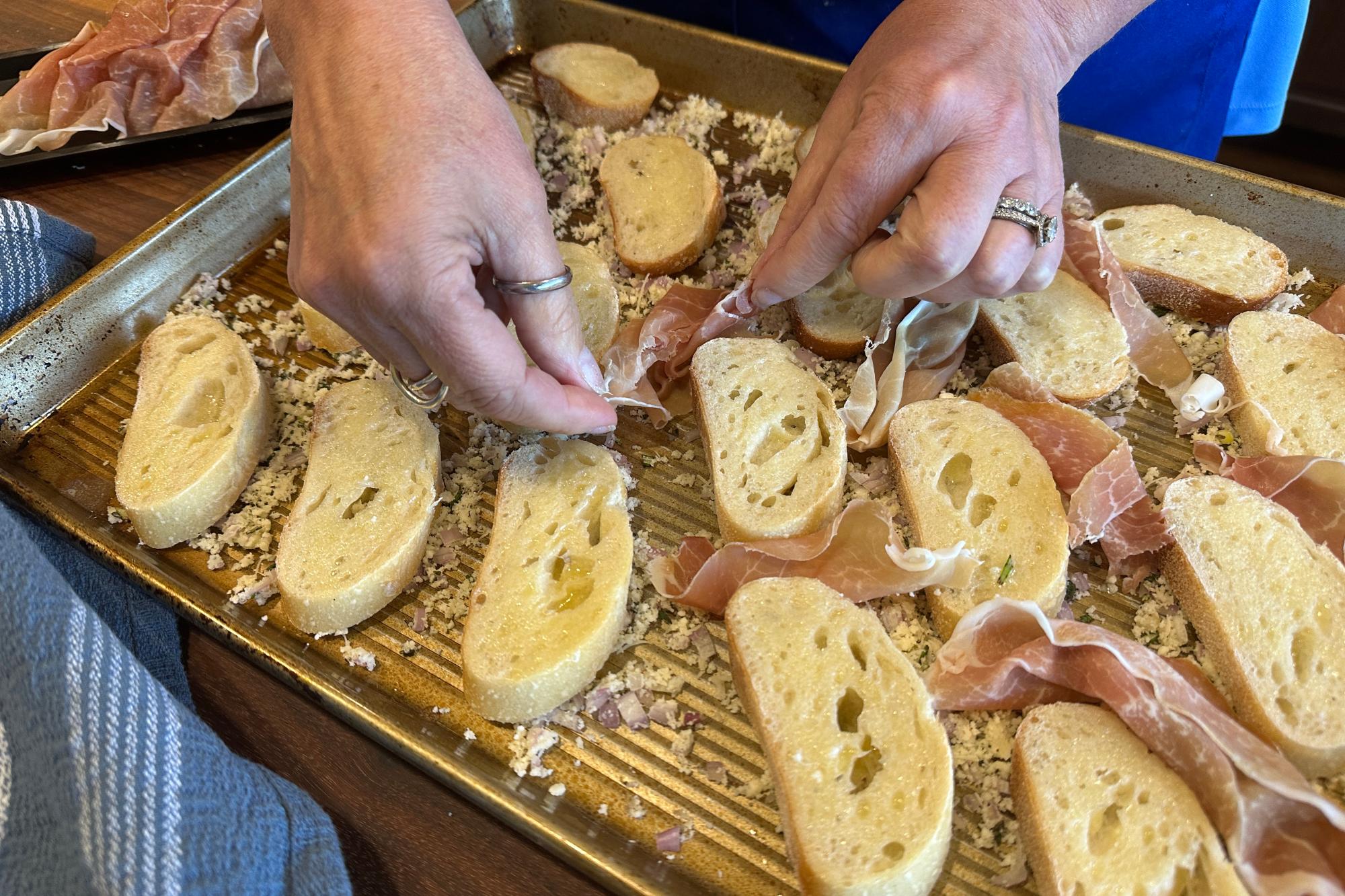 Tuck the slices of prosciutto around the bread.