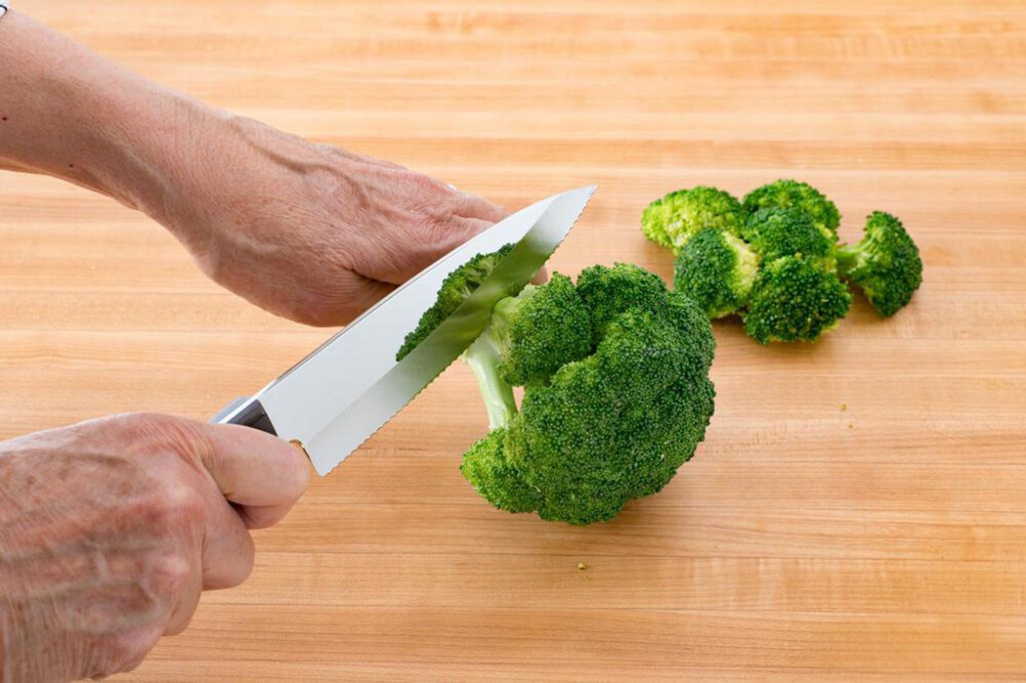 removing florets from a head of broccoli