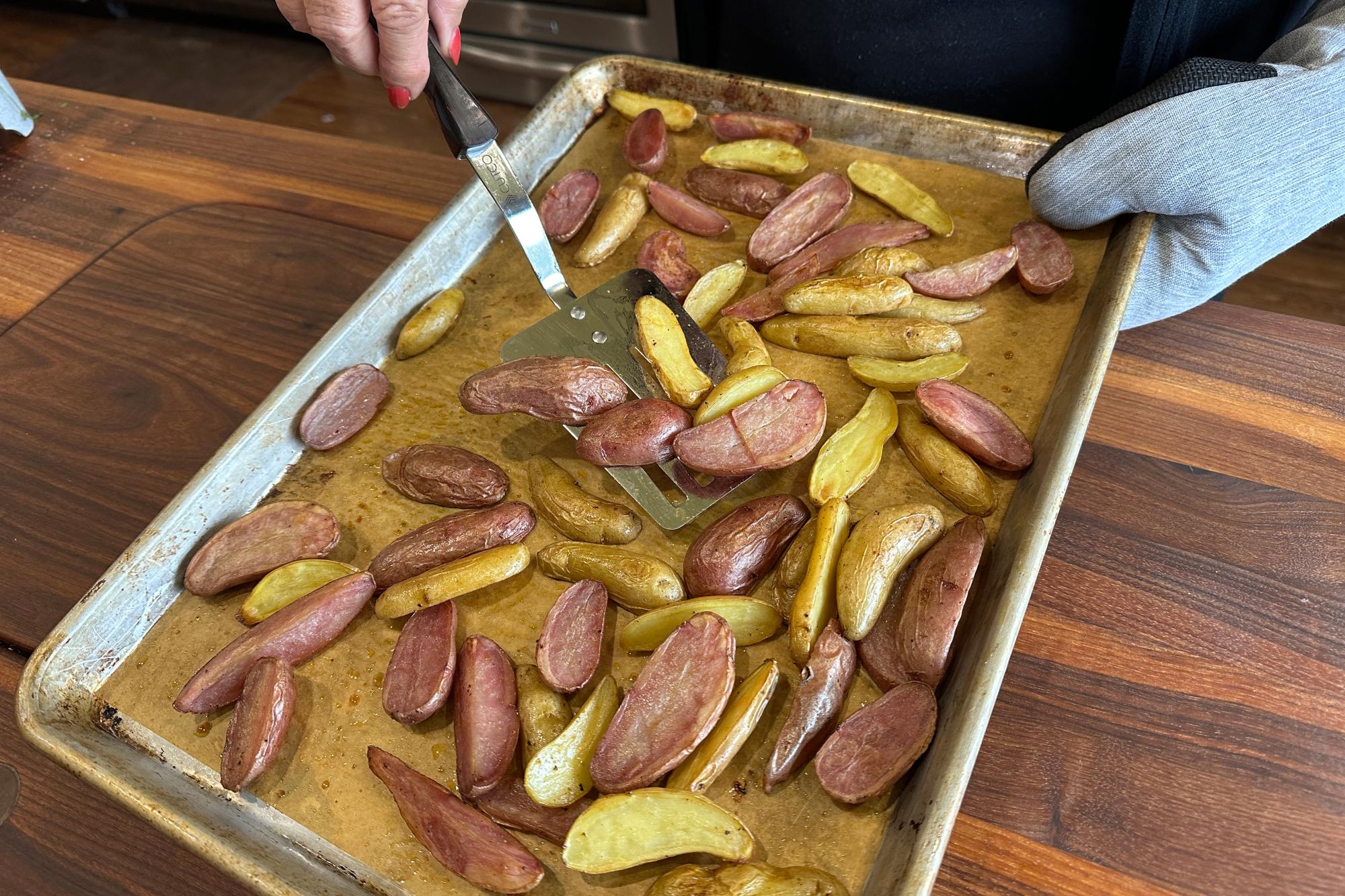 Flipping the potatoes with Slotted Turner.