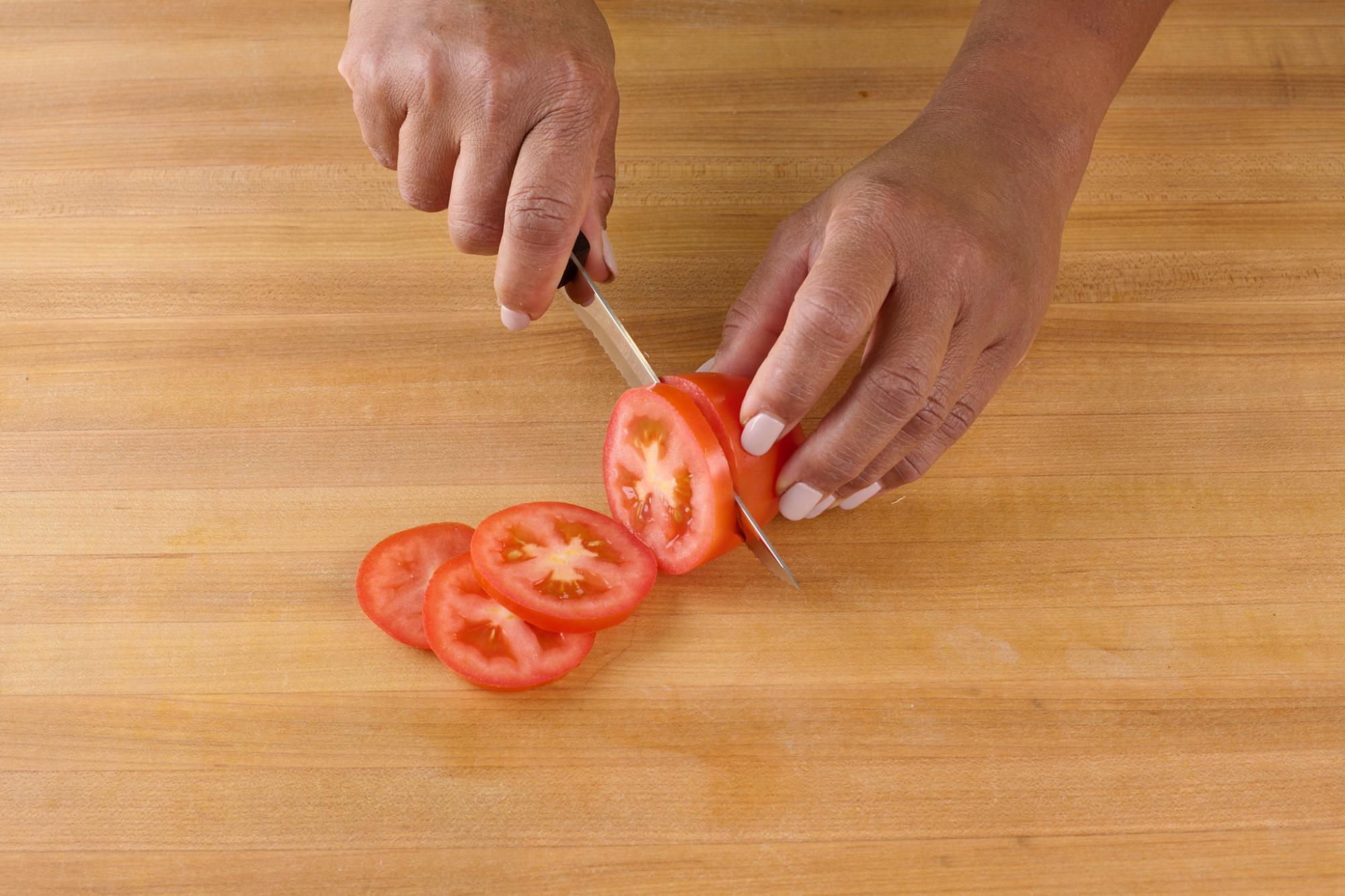 thinly slice the plum tomatoes