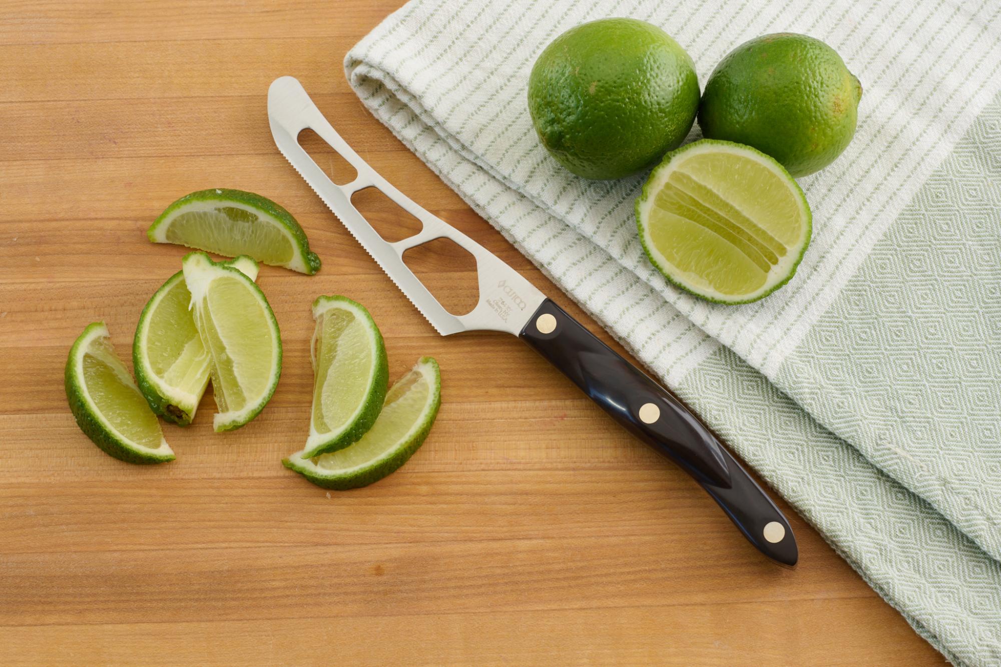 Traditional Cheese Knife with lime wedges