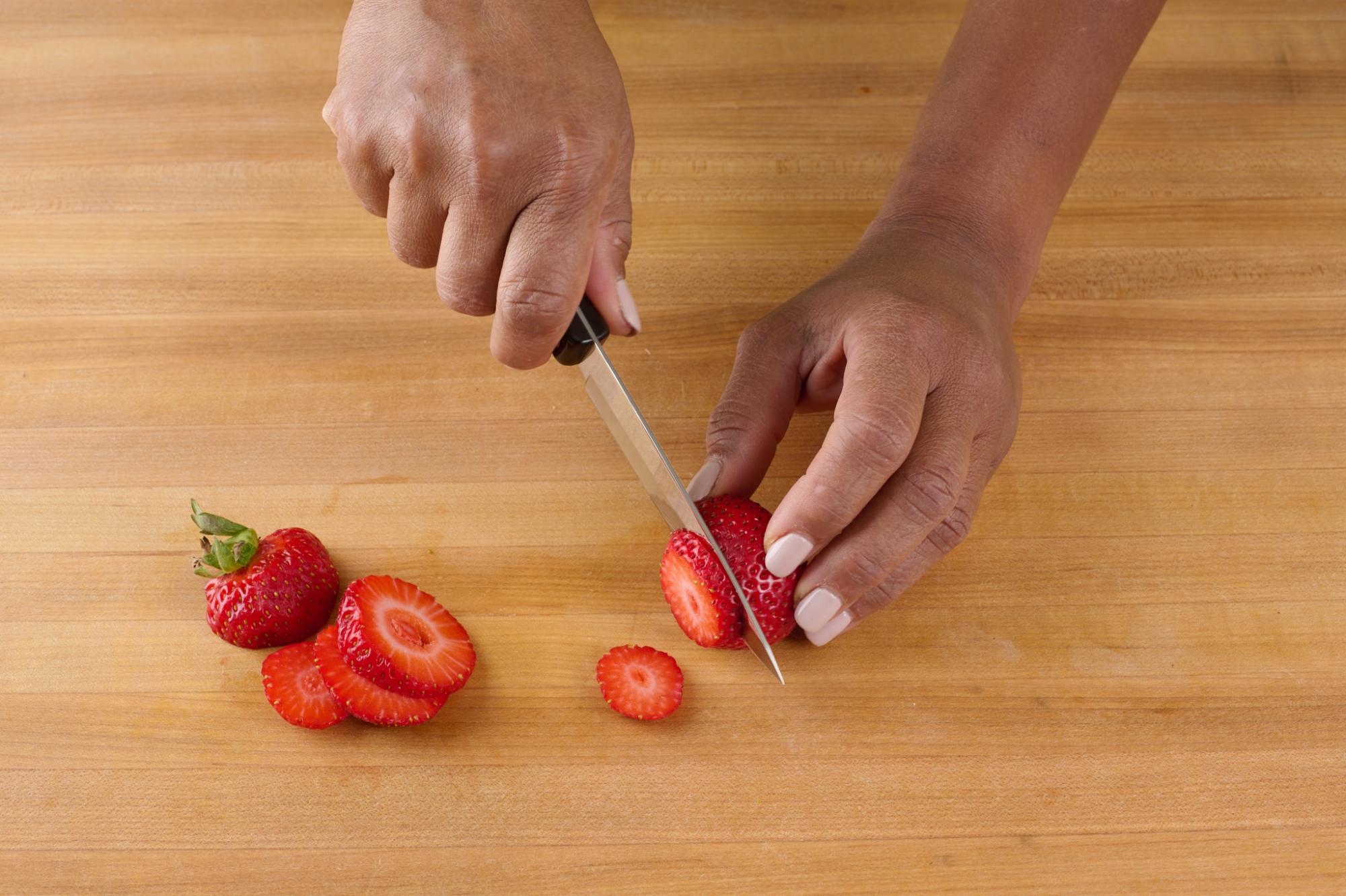 Slicing strawberries with 4″ Paring Knife