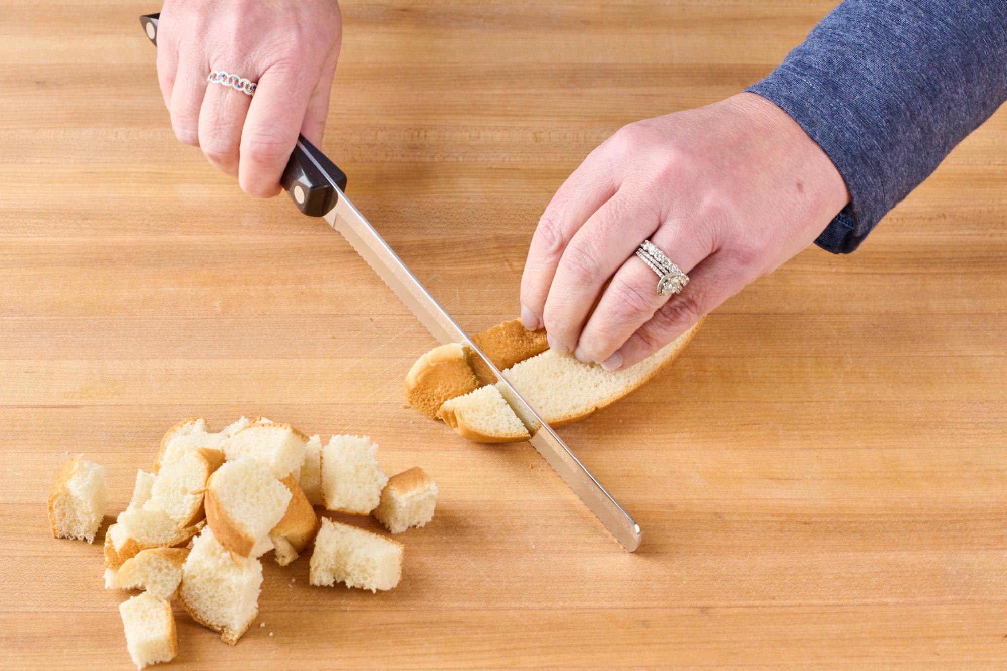 Petite Slicer cutting hot dog buns.