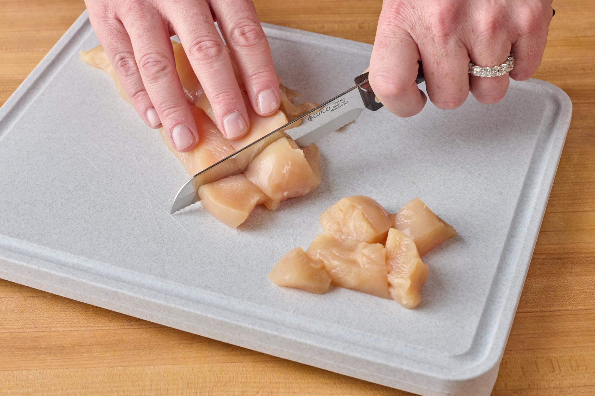 Cutting chicken with Santoku-Style Trimmer