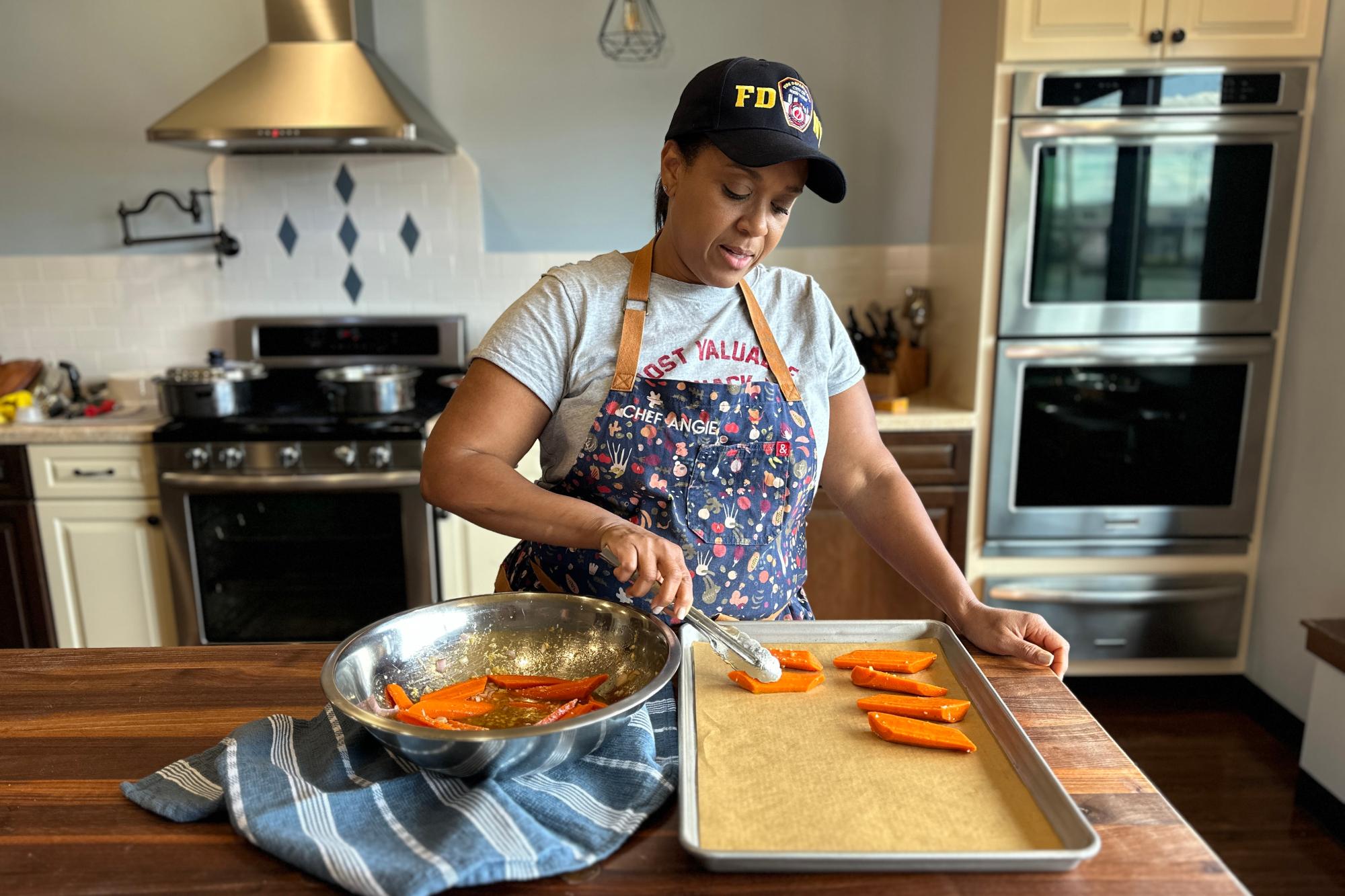 Placing carrots onto baking sheet.