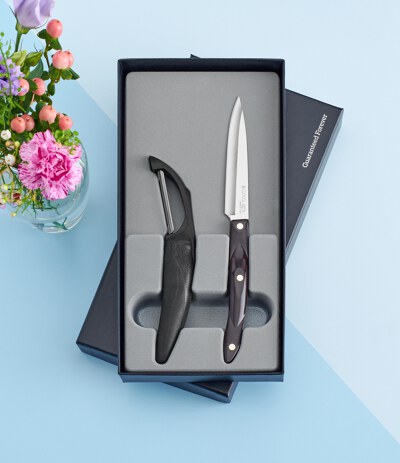 New Model 1501 CUTCO Vegetable Peeler in factory-provided plastic bag. . .  . . . . . High Carbon Stainless blade and black handle