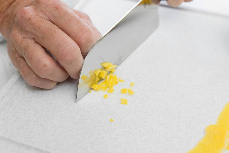 Using a Petite Santoku to mince the lemon peel.