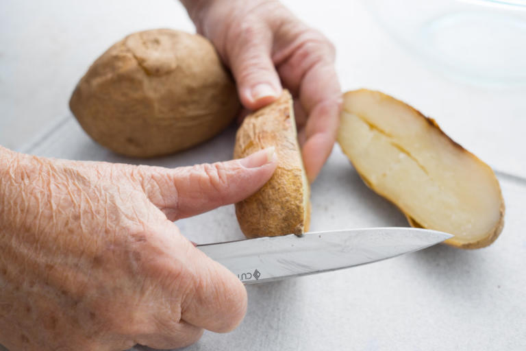 Peeling the potato with a 4 Inch Paring Knife.