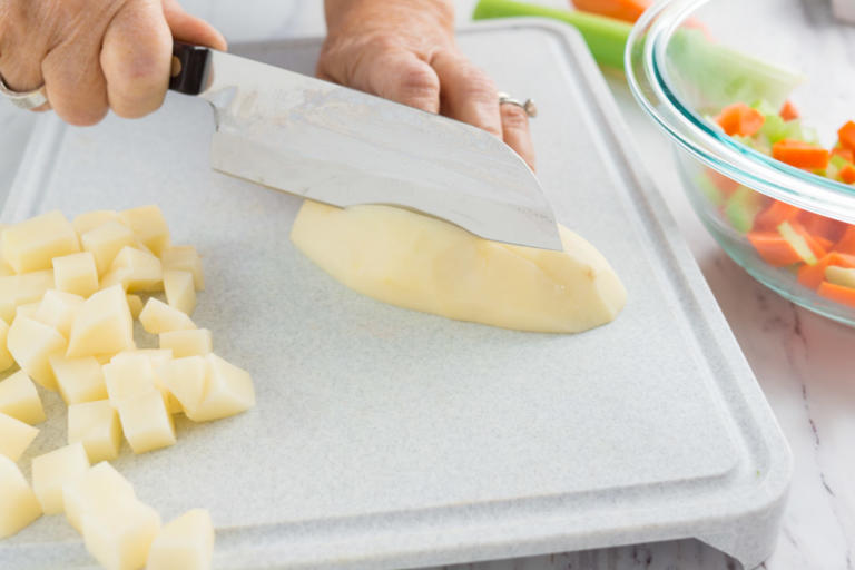 Dicing the potato with a Santoku.