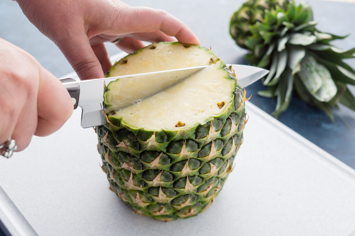 Cutting a pineapple with a Petite Chef.