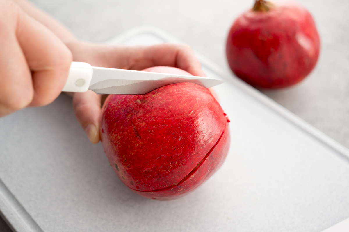 Cutting a pomegranate with a 4 Inch Gourmet Paring Knife.